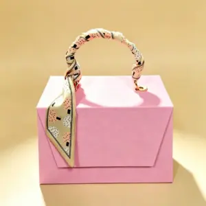 Handbag-style rigid gift box in soft pastel pink
